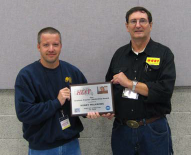 Robby (on left) receiving award from Bill Hills, previous HEAT President